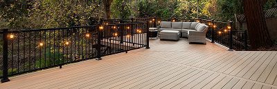 Finished composite deck with railing and outdoor furniture