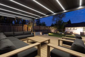 Saratoga deck with pergola and outdoor sofa at night
