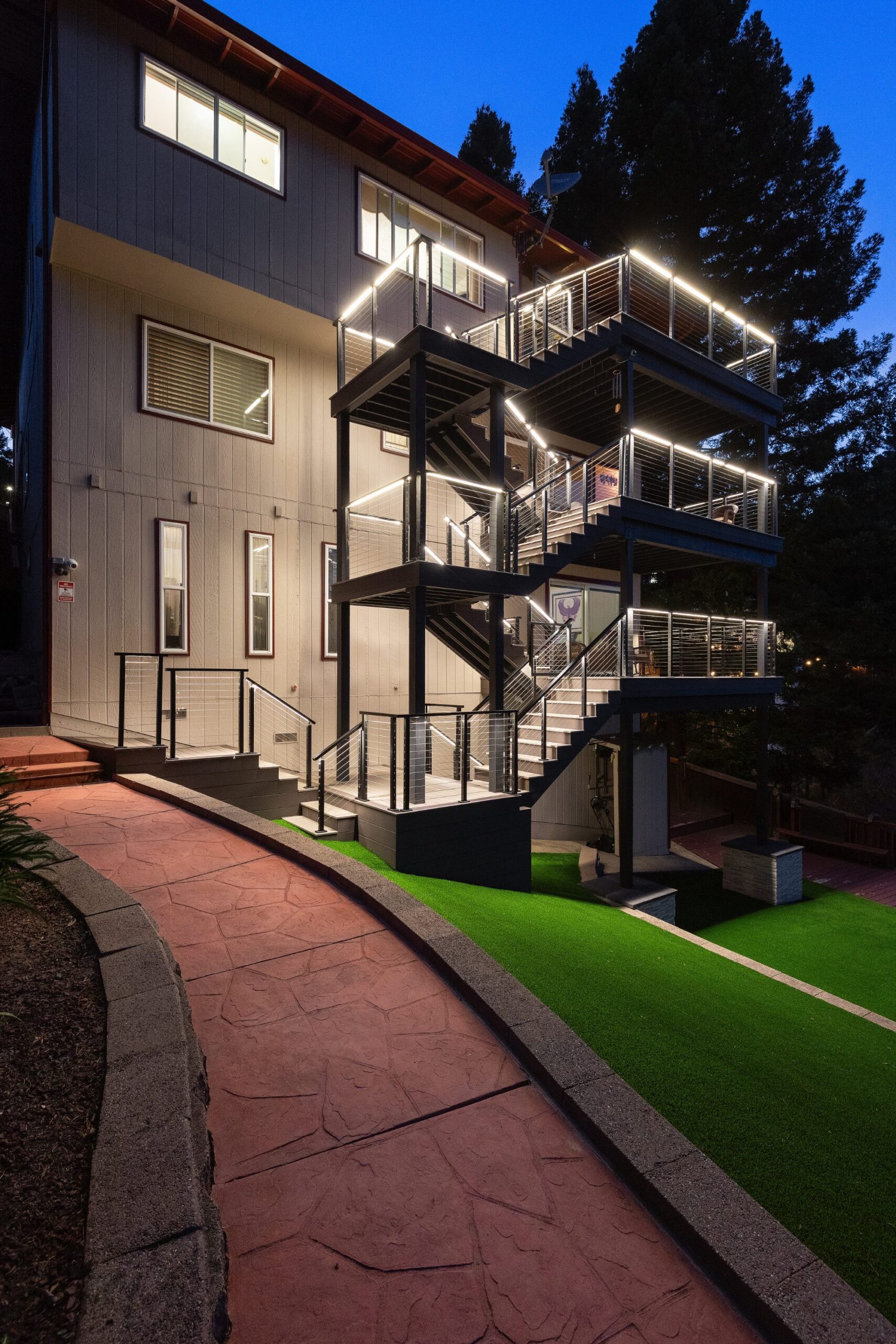 Deck stairs with cable railing and LED lighting in Belmont, CA