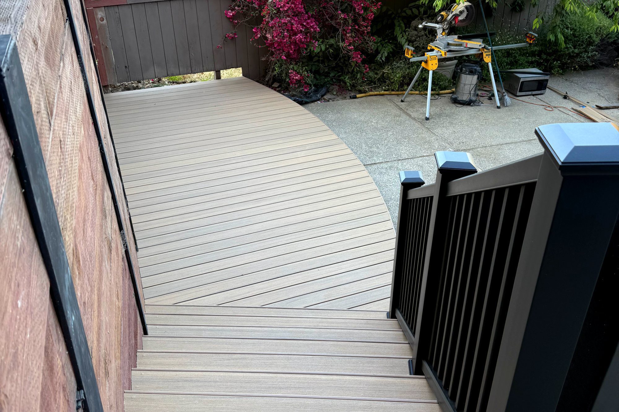 Composite stairs and landing with railing in Brisbane, CA