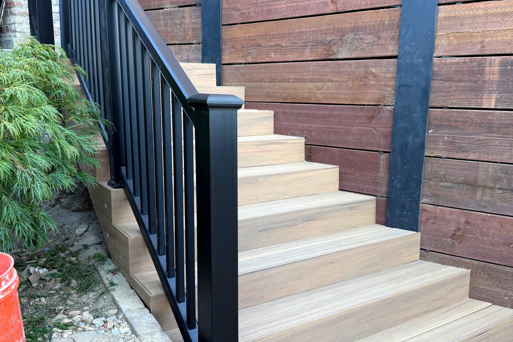 Composite deck stairs with aluminum railing in Brisbane, CA