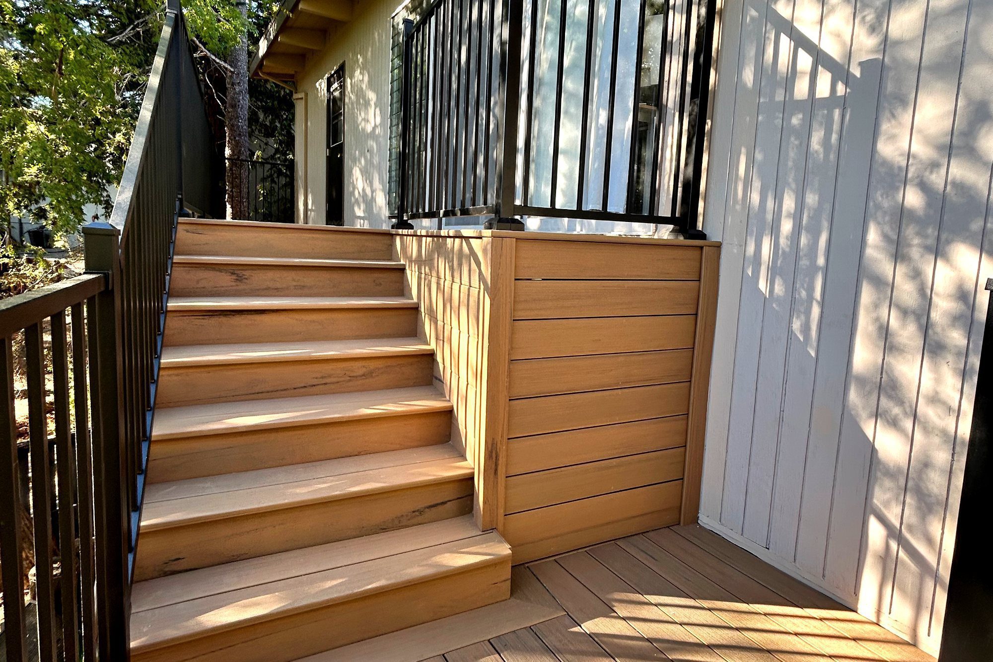 Deck stairs with black steel railing in Burlingame, CA