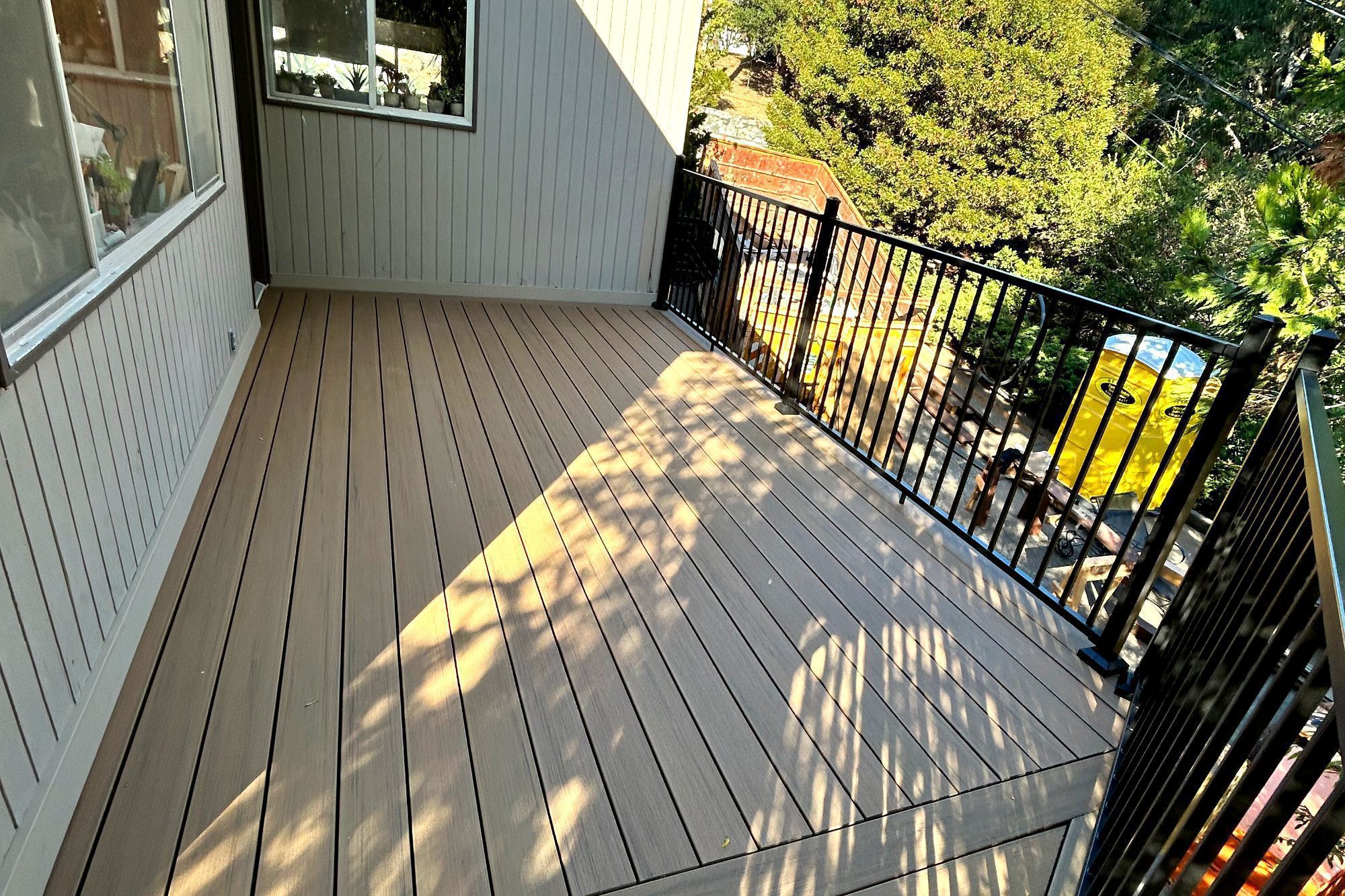 TimberTech Prime+ Coconut Husk deck beside a house in Burlingame, CA