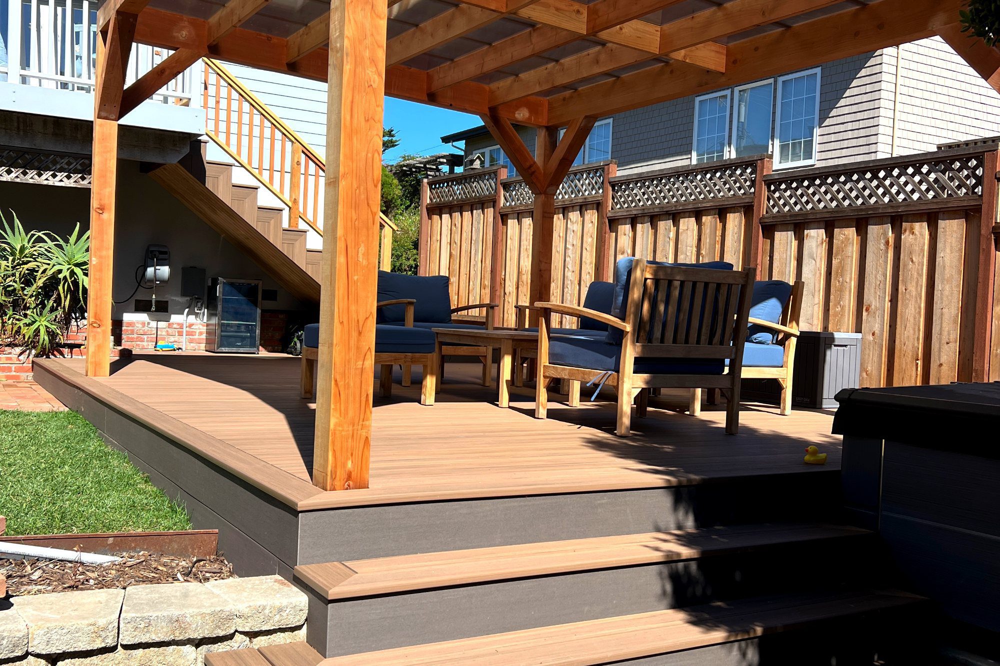 Composite deck with pergola and stairs in El Granada, CA
