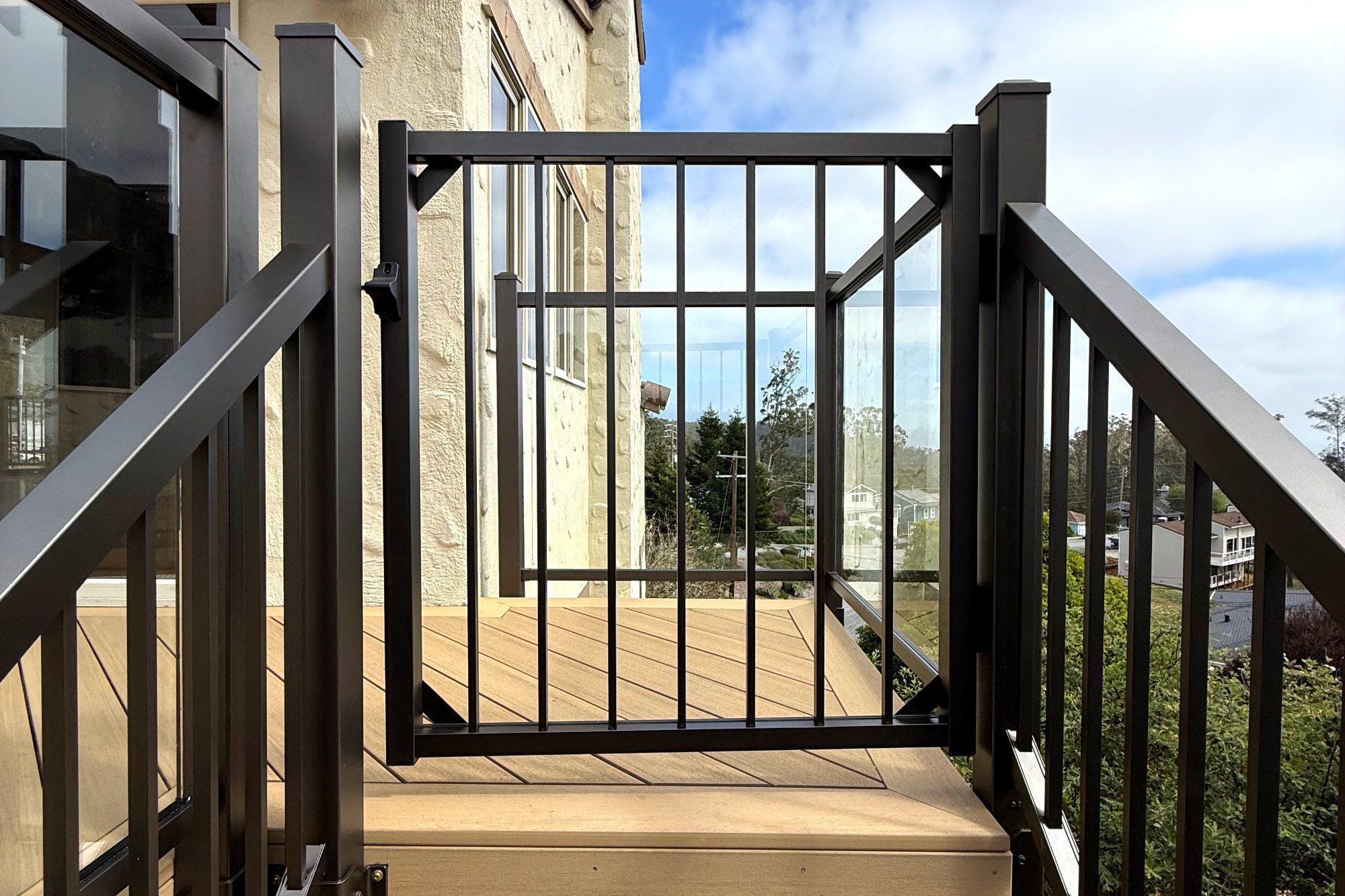 Deck landing with aluminum railing and gate in Half Moon Bay, CA