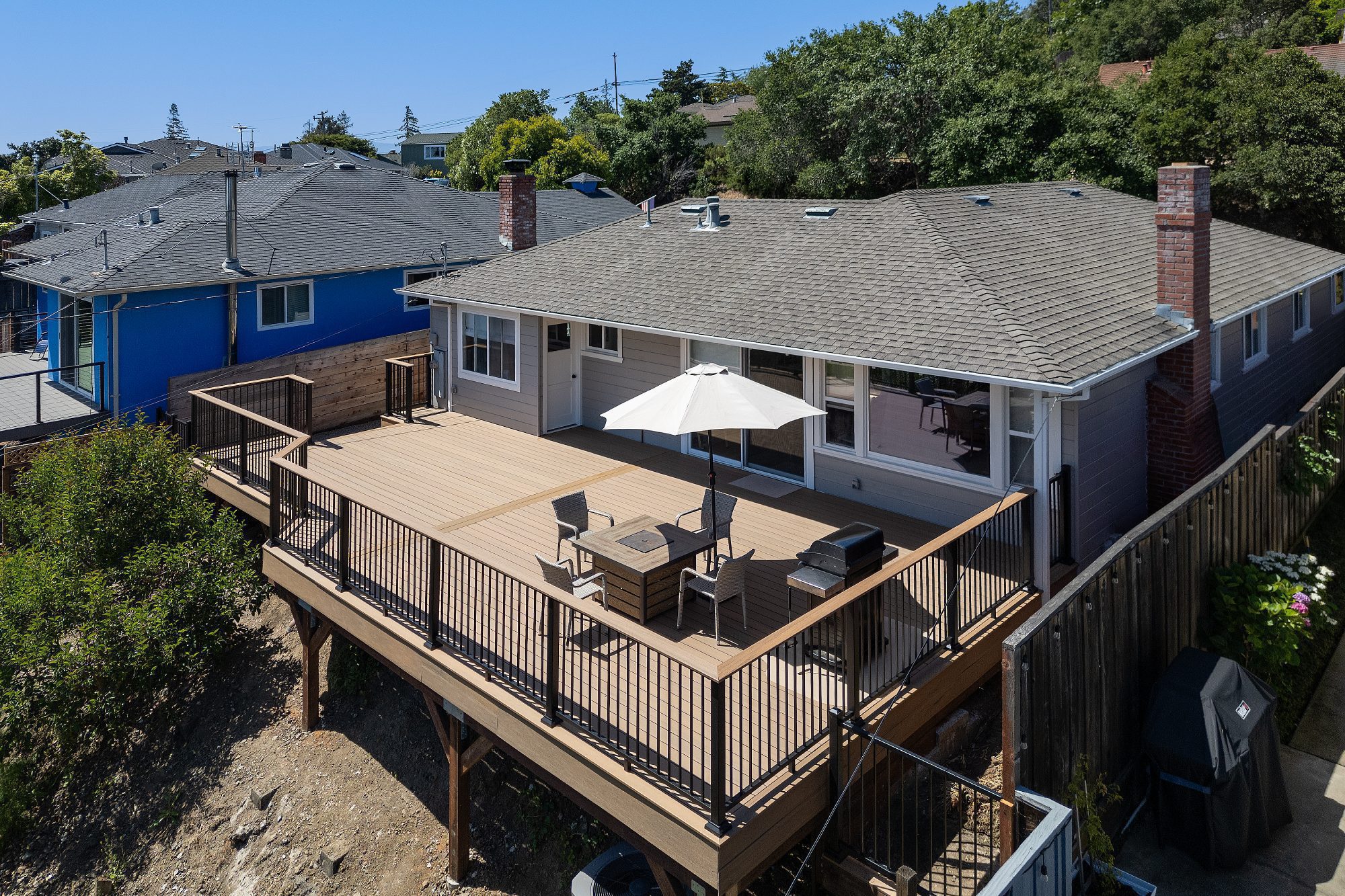 Aerial view of a custom TimberTech composite deck with black aluminum railing in San Carlos, CA
