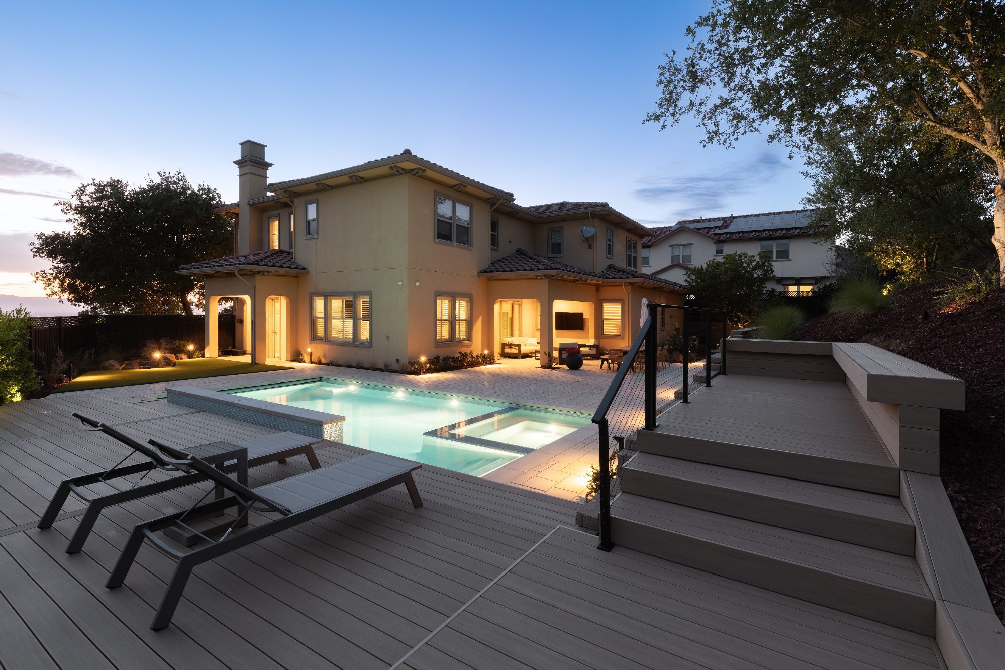 Evening view of a composite deck and pool in San Jose, CA
