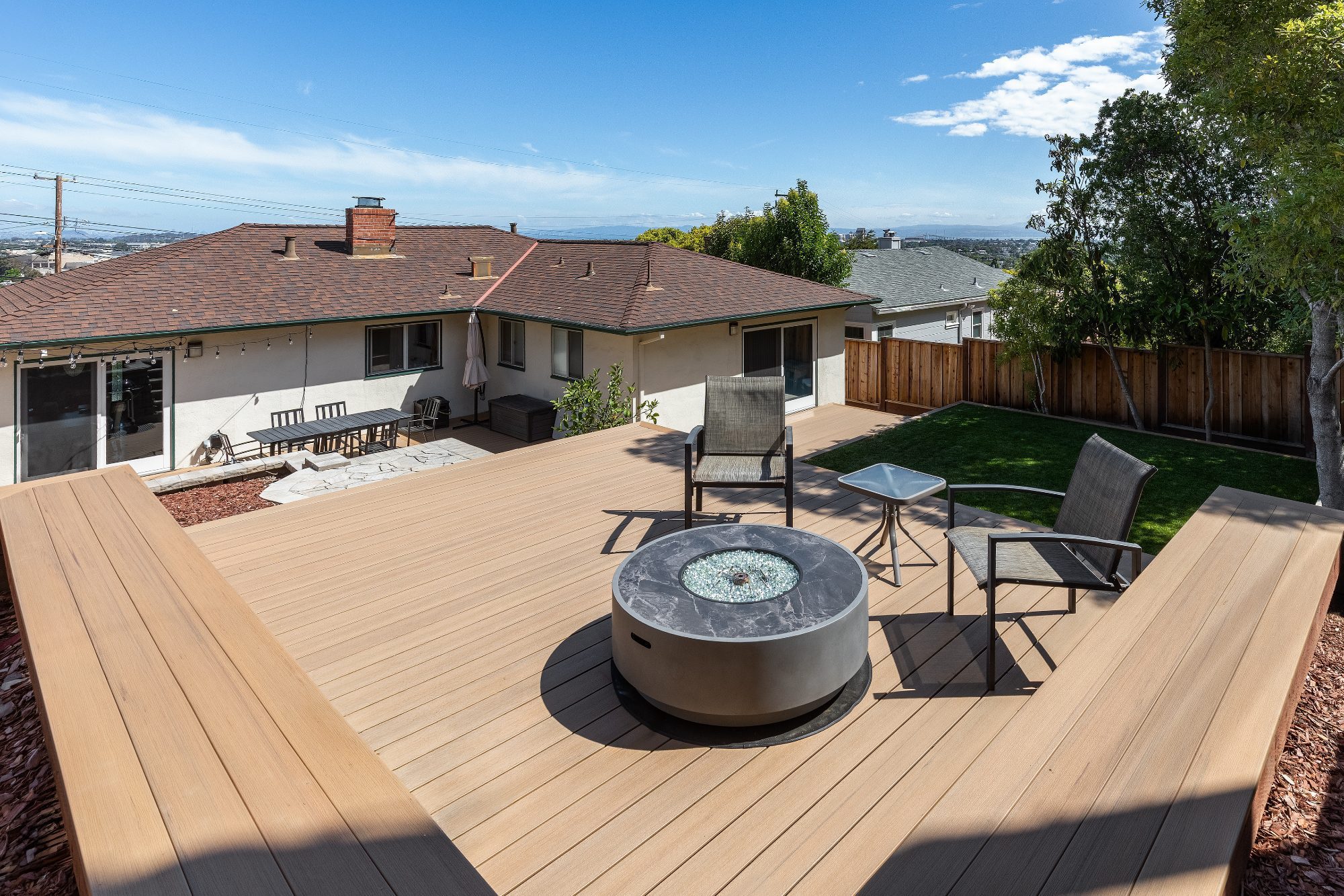 Timbertech composite deck with fire pit in San Mateo, CA backyard