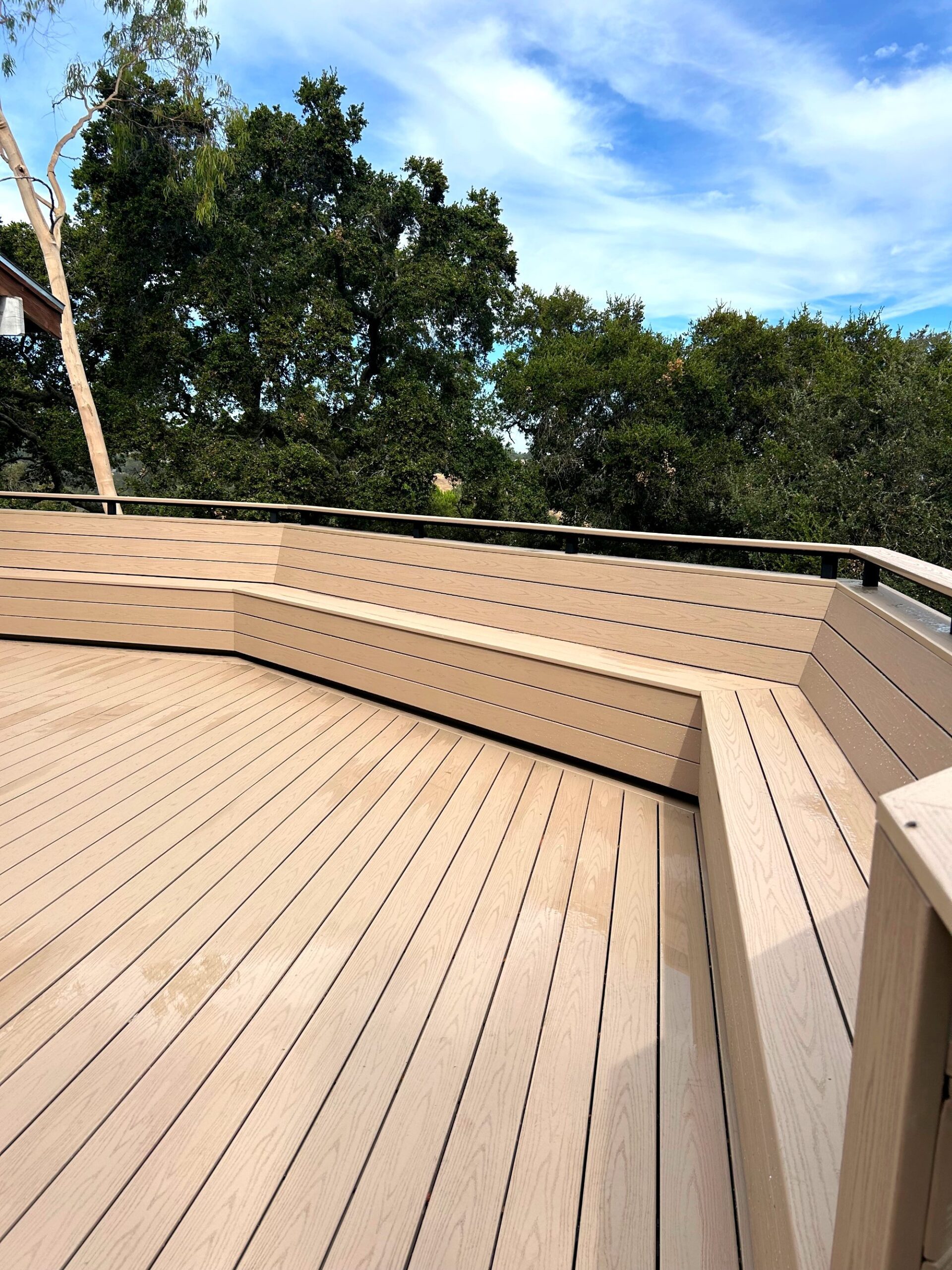Composite deck with bench seating and railing in Woodside, CA