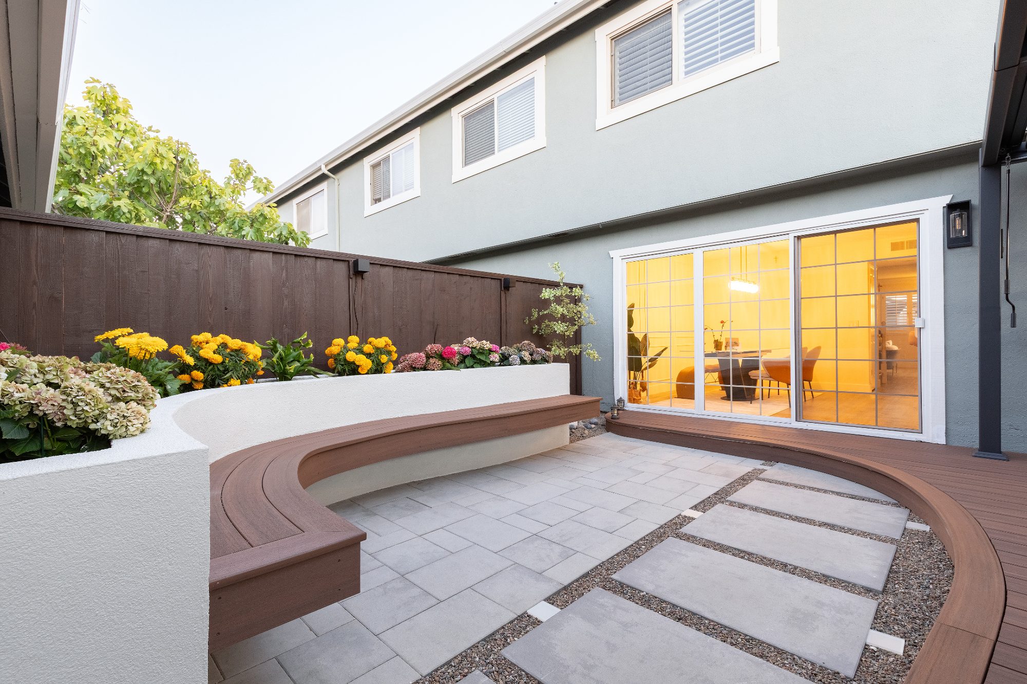 Composite deck with built-in bench and planters in Foster City, CA