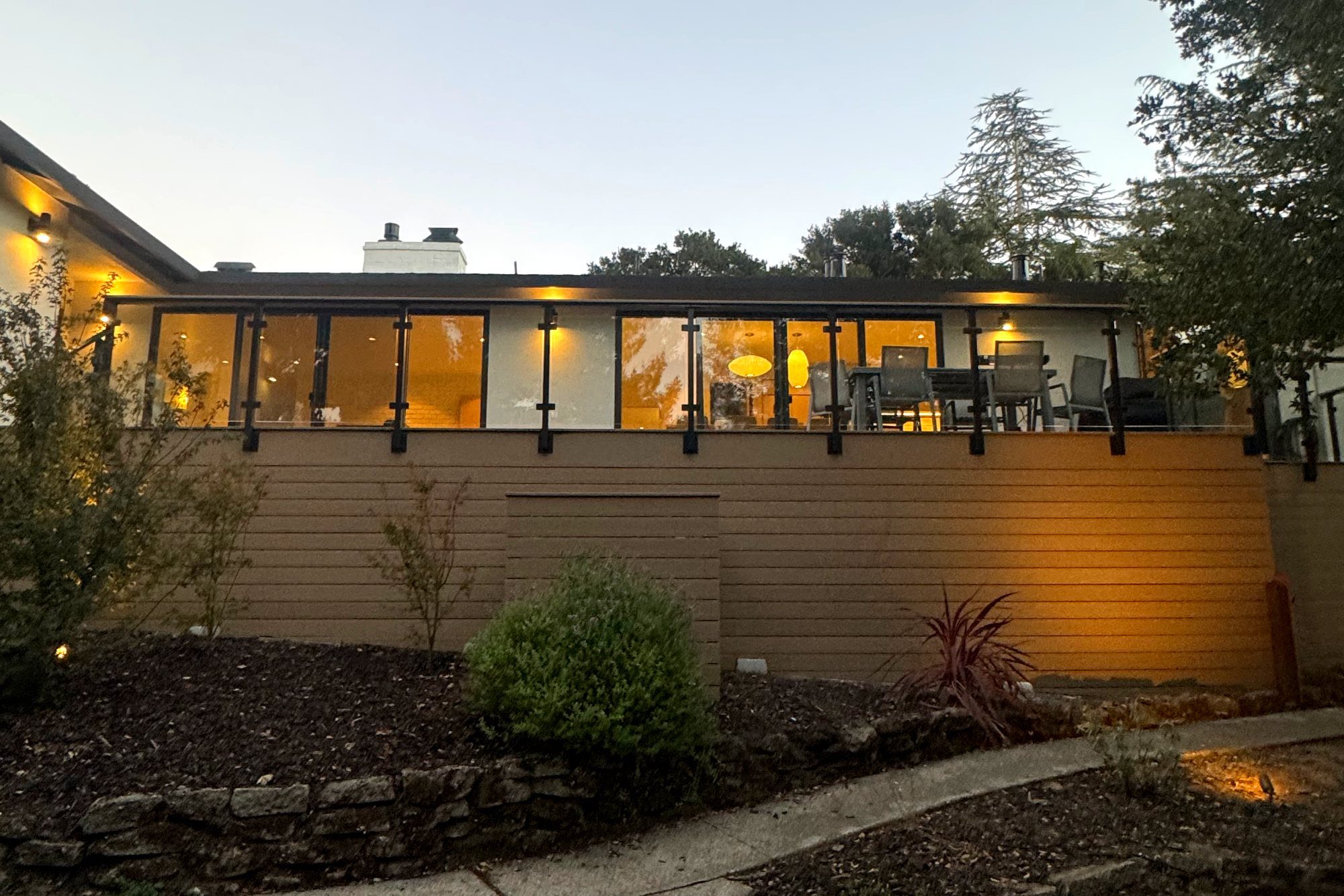 Deck and landscaping lit at dusk in Hillsborough, CA