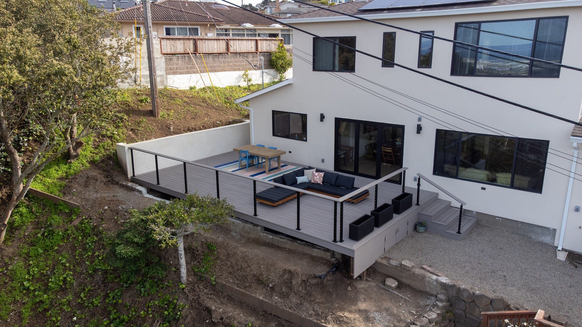 Raised TimberTech Vintage Coastline deck with cable railing in Millbrae, CA