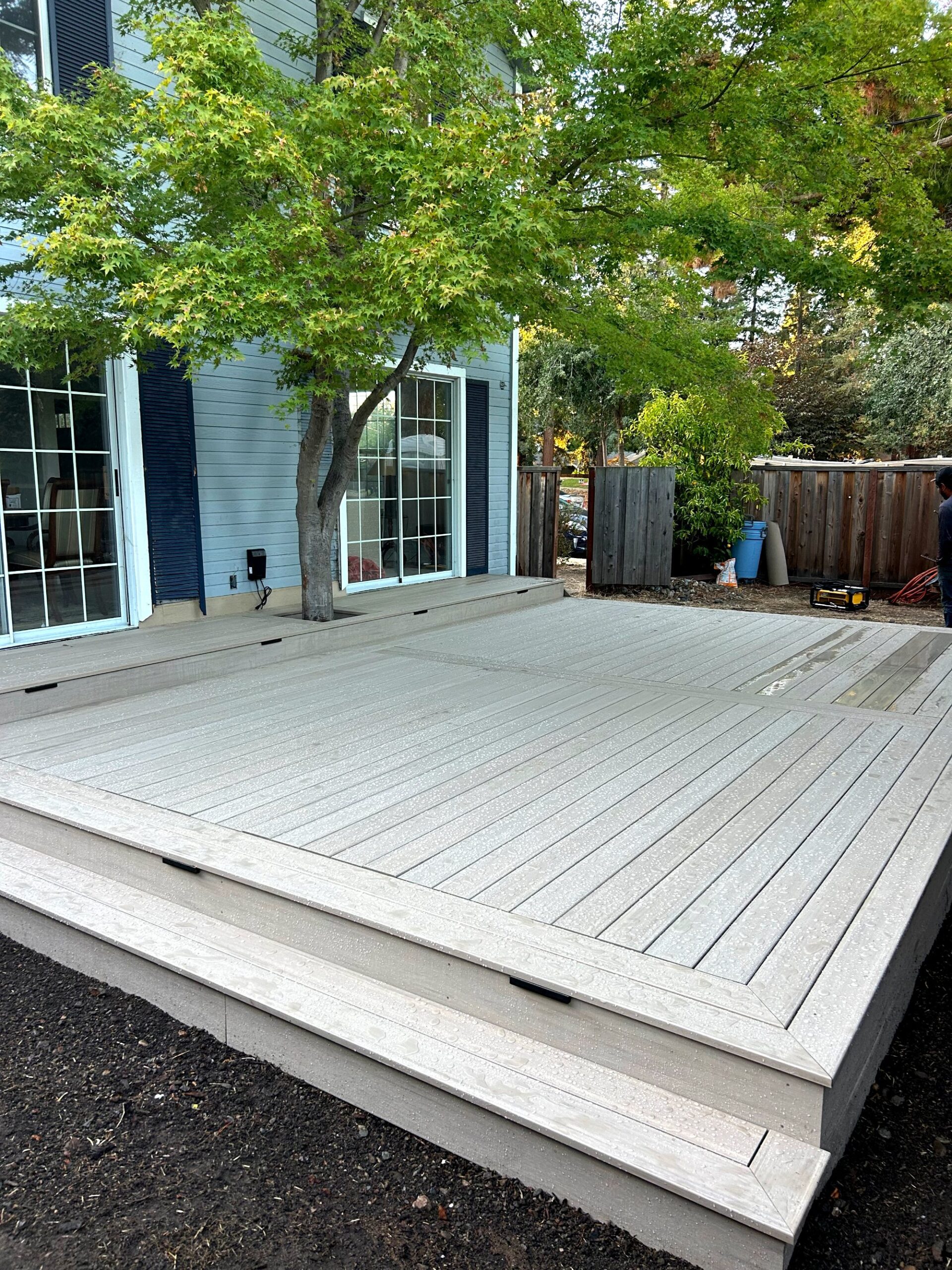 Composite deck with steps around a mature tree in Palo Alto, CA